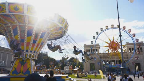 Chain-carousel-and-Ferris-wheel-at-Munich's-Konigplatz