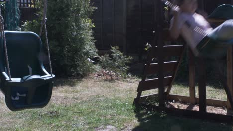Joyous-Four-Year-Old-UK-Asian-Child-On-Swing-In-The-Garden