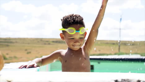 South-African-Boy-Splashing-in-Pool
