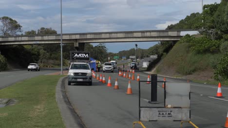 Police-Mobile-Parked-On-The-Road---Few-Cars-Travelling-And-Crossing-The-NSW---QLD-State-Border---Police-And-Military-Checkpoint---Coronavirus-Pandemic-In-Australia