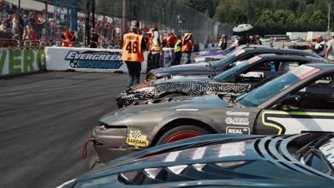 Group-of-Heavily-Modified-Cars-Parked-on-Racetrack-at-Driftcon