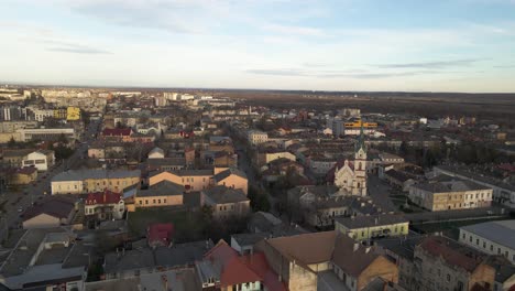 Aerial-shot-of-golden-sunlight-hitting-city-of-Lviv-in-Ukraine