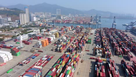 Shenzhen-commercial-Port-terminal-with-docked-Ships-and-Container-yard,-Aerial-view