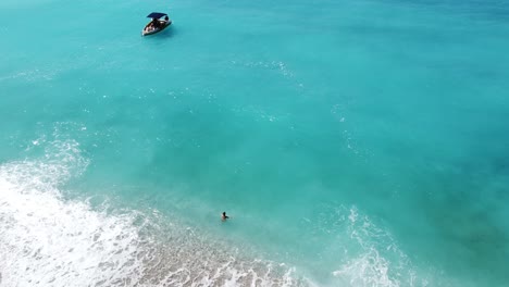 Girl-enjoying-the-turquoise-sea-on-Paradise-Beach-in-Turkey