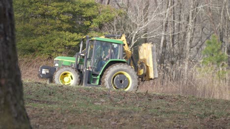 large-tractor-driving-in-forest-slow-motion-hand-held