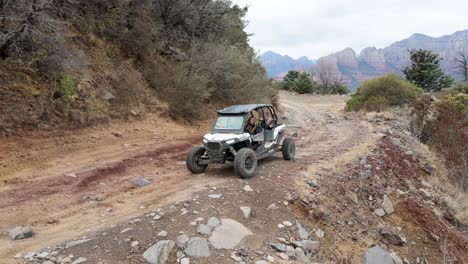 Group-of-friends-adventure-driving-an-all-terrain-vehicle,-Red-Rocks-in-Sedona,-Arizona