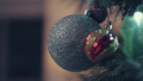 Close-Up-Of-Glittering-Baubles-Hanging-On-A-Christmas-Tree