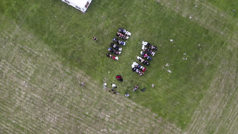 Overhead-view-of-an-outdoor-wedding-ceremony-in-a-grassy-field,Czechia