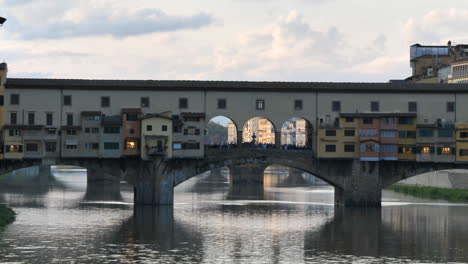 Track-right-shot-of-Ponte-Vecchio-during-sunset
