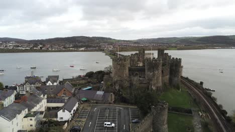 Historical-medieval-Conwy-castle-landmark-aerial-pull-back-view