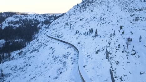 DRONE-VIDEO-OF-ABANDONED-DONNNER-PASS-CALIFORNIA-RAILROAD-TUNNELS-ON-MOUNTAIN-PASS-COVERED-IN-SNOW