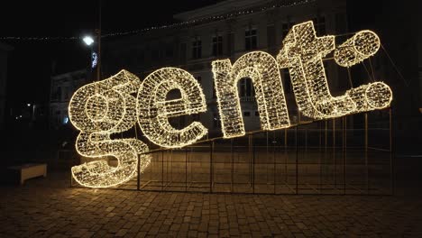 Blinking-luminous-indication-signal-Gent:,-icon-text-with-glowing-letters-of-the-city-of-Ghent,-Belgium