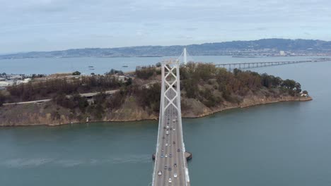 Aerial:-drivers-crossing-the-bridge,-drove-view