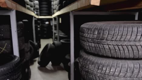 car-tyres-stacked-at-the-tyre-repairs-mechanics-stock-video-stock-footage