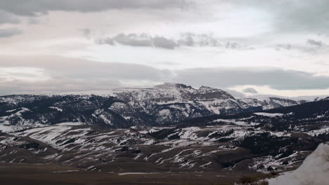 Wide-view-of-Sleeping-Indian-mountain-range-in-Jackson-Wyoming-with-snowy-hills-and-plains-Prores-4k-30p