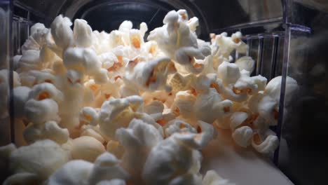 Close-up-shot-of-tasty-popcorns-in-motion-lighting-by-professional-studio-light