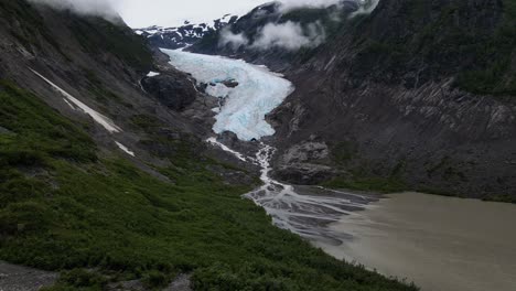 Bear-Glacier-cascading-down-a-rugged-mountain-into-Strohn-Lake-in-Bear-Glacier-Provincial-Park,-British-Columbia,-Canada