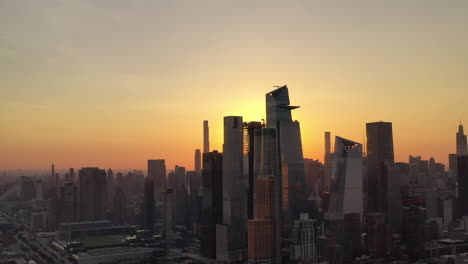 A-high-angle,-aerial-view-of-Manhattan's-Hudson-Yards-at-sunrise-on-a-clear-day