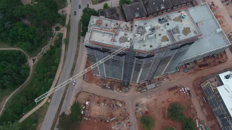 Aerial-over-building-being-constructed-in-Houston,-Texas