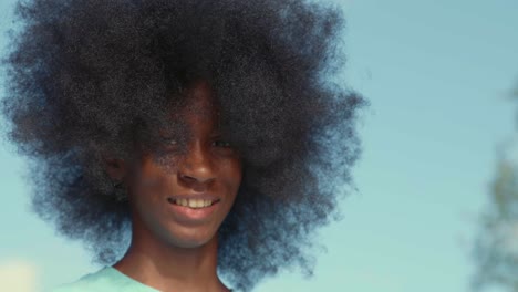 African-American-adolescent-boy-with-huge-Afro-looking-into-the-camera