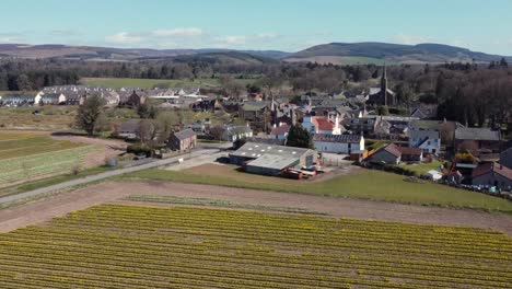 Aerial-view-of-the-Scottish-town-of-Fettercairn-on-a-sunny-spring-day,-Aberdeenshire,-Scotland