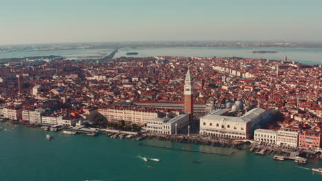 Close-up-dolly-forward-drone-shot-over-Venice-lagoon-towards-St-Marco-Square-tower