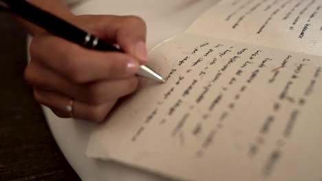 Close-up-of-female-hand-writing.-Gimbal