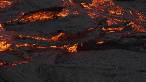 Incredible-view-of-masses-of-earth-moving-as-river-stream-of-glowing-lava-flows