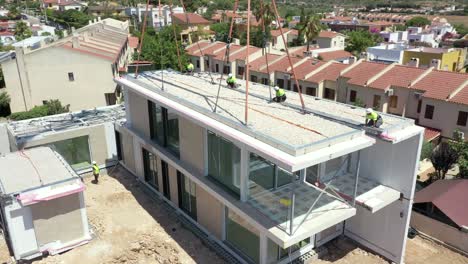 Worker-almost-falling-over-on-a-construction-site-for-new-homes