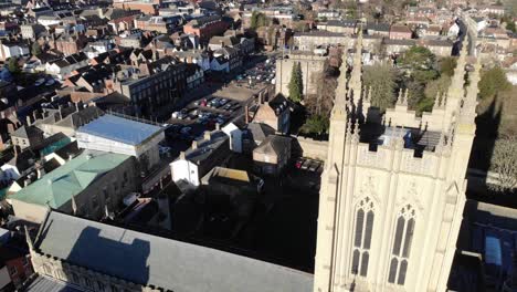 Drone-footage-of-St-Edmundsbury-Cathedral-looking-onto-Abbey-Gate-Street-in-Bury-St-Edmunds,-UK