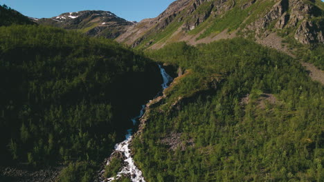 Flowing-Stream-Of-Turelva-On-The-Valley-Covered-With-Dense-Trees-In-Finnmark,-Norway,-Europe