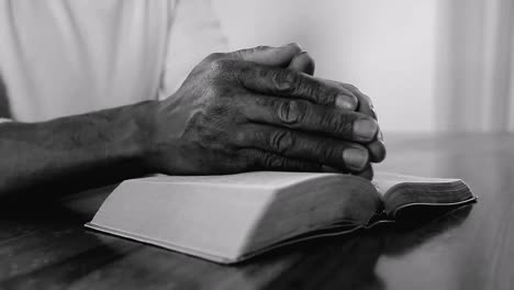 man-praying-with-the-bible-on-white-background-stock-footage
