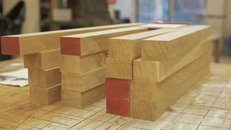 Oak-timbers-planed-and-stacked-ready-for-couch-furniture-assembly