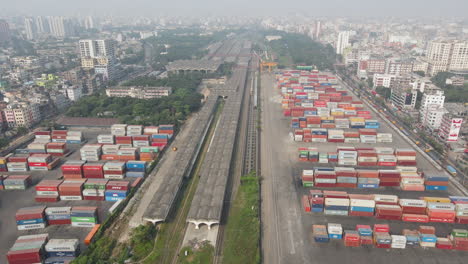 Aerial-drone-shot-of-inland-shipping-port-with-container-in-a-city