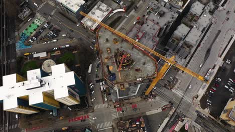 Top-down-aerial-of-a-skyscraper-being-built-in-Seattle,-WA