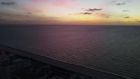 Orange,-deep-purple-dawn:-Calm-ocean-sunrise-off-Surfside,-Florida