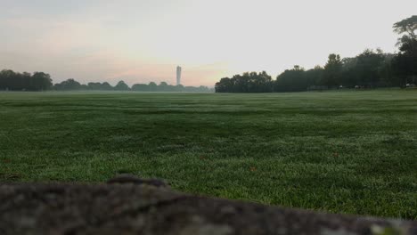 View-of-Turning-Torso-In-Malmö-From-a-Green-Area-With-Grass-and-Stone-In-The-Foreground