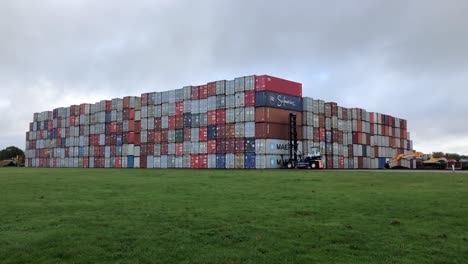 Stack-of-Shipping-containers-being-stored-in-an-airfield-close-to-Eye-in-Suffolk,-UK