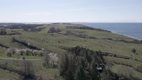 Drone-footage-of-small-beautiful-rolling-hills-on-the-climate-neutral-danish-island-of-Samsø