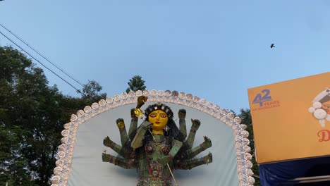 Close-up-view-of-a-Durga-Idol-made-of-used-metal-utensils-at-a-Puja-pandal-in-Kolkata,-India