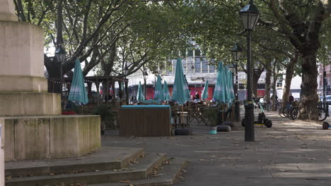 Empty-Outdoor-Dinning-Tables-And-Chairs-In-Sloane-Square-Near-Venus-Fountain-In-London