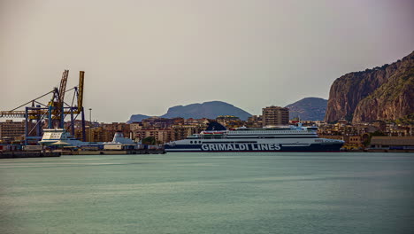 View-of-cruise-ship,-Grimaldi-lines-docked-in-port-of-Palermo,-Palermo-italy-in-timelapse