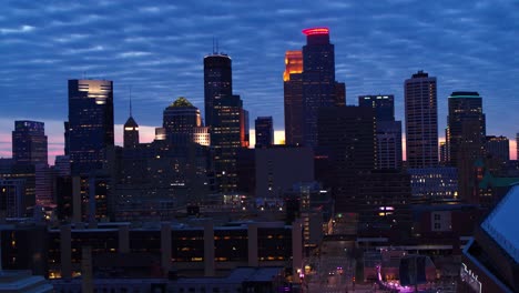 Aerial,-skyscrapers-of-downtown-Minneapolis-skyline-in-the-evening,-overcast-day
