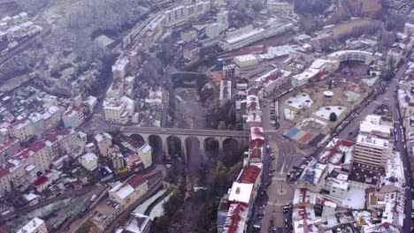 Drone-pull-back-from-iconic-bridge-in-heart-of-small-town-Saint-Claude