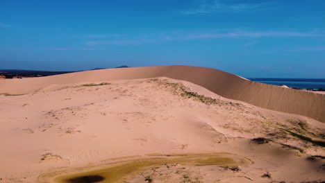 Slow-aerial-flying-forward-over-sand-dunes-in-Mui-dinh,-Vietnam