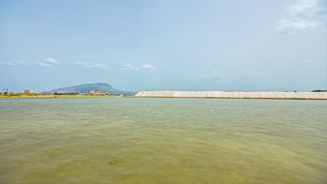 Scenic-view-of-pile-of-Paceco-salt-pans-Italian-nature-reserve-in-Province-of-Trapani,-Italy-at-daytime