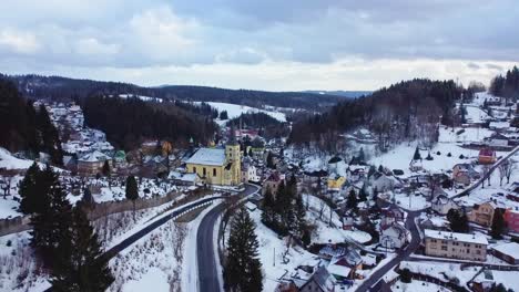 Aerial-drone-view-of-small-village-Janov-nad-Nisou-near-Liberec-and-Jablonec,-north-of-Czech-Republic,-winter-day