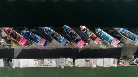 Aerial-View-of-Fishing-Boats-In-The-Harbor-At-Playa-Maguillines-In-Constitucion,-Maule,-Chile