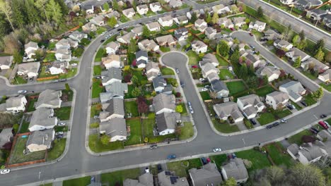 Medium-overhead-aerial-shot-of-a-standard-cookie-cutter-neighborhood-in-North-America