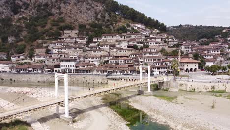 Bridge-and-Old-Town-of-Berat,-Albania---Aerial-Drone-View,-Reverse